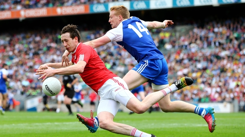 Monaghan's Kieran Hughes tackles Colm Cavanagh of Tyrone