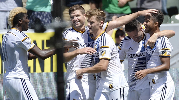 Robbie Keane celebrates with his Galaxy team-mates after recording yet another win at home
