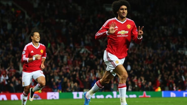 Marouane Fellaini celebrates a goal which should help see United into the Champions League group stage