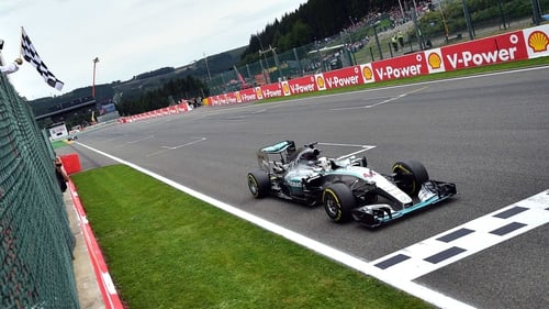 Lewis Hamilton crosses the finish line at Spa-Francorchamps