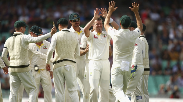 Peter Siddle of Australia celebrates after taking the wicket of Stuart Broad