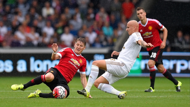 Bastian Schweinsteiger and Jonjo Shelvey contest a 50/50 ball