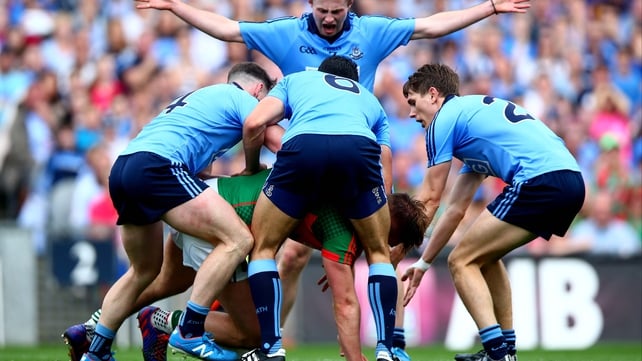 Aidan O'Shea is surrounded by four Dubs