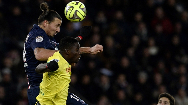 Papy Djilobodji competes in the air with Paris Saint-Germain's Swedish forward Zlatan Ibrahimovic