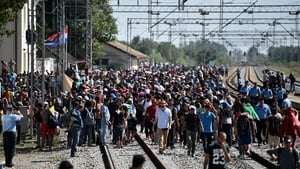 People wait at Tovarnik station in Croatia for a train to Zagreb