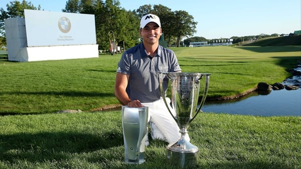 Jason Day with the winner's trophy