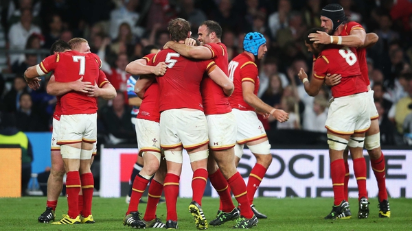Wales players celebrate after their pulsating victory at Twickenham