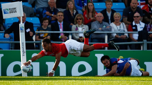 Telusa Veainu of Tonga goes over for a try which is disallowed for hand in touch