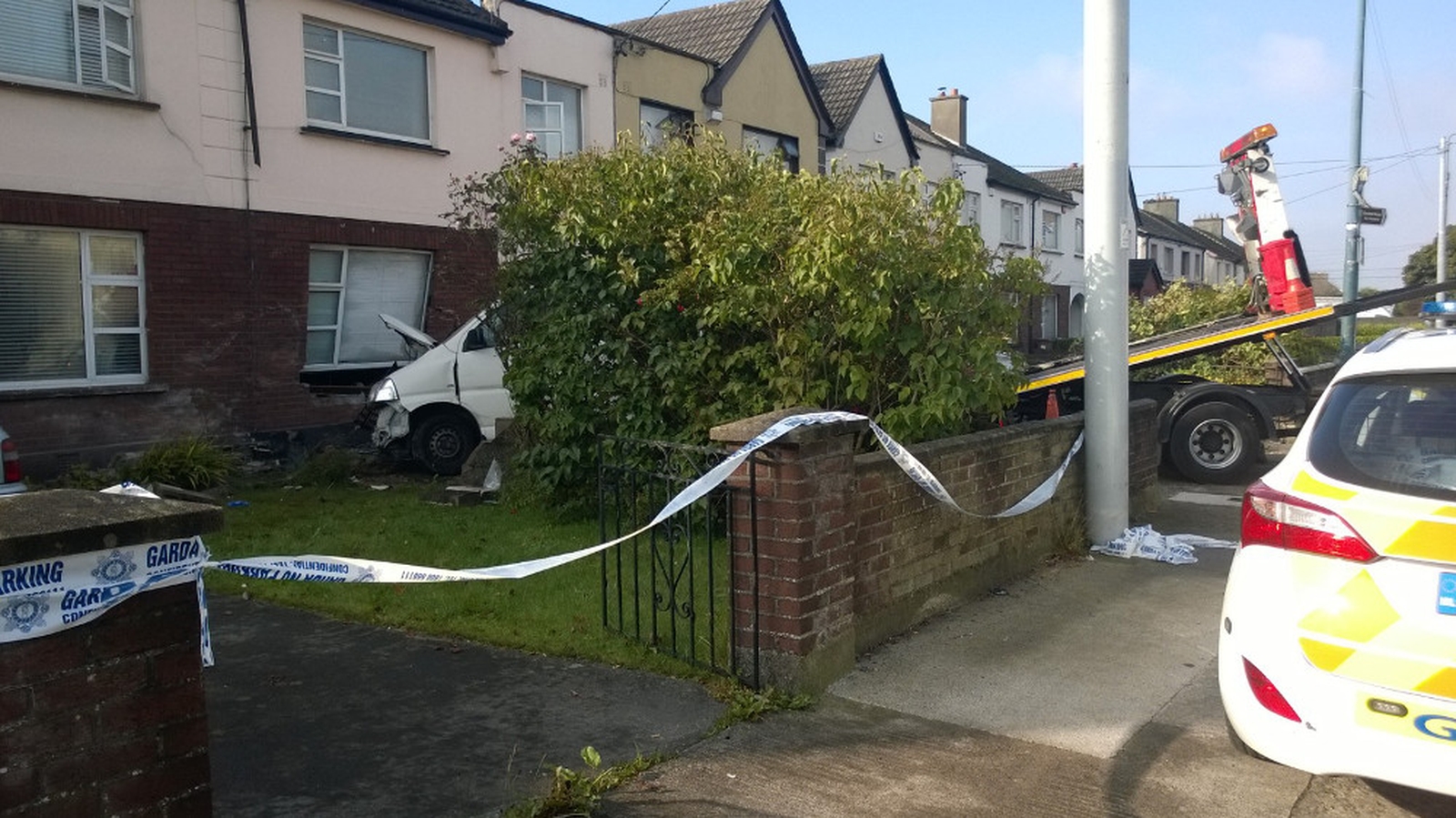 Man injured after van crashes into house