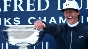 Thorbjorn Olesen poses with the trophy after wrapping up his third European Tour title