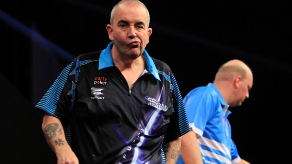 Phil Taylor almost hit a nine-dart finish but his tournament is over (pic: Lawrence Lustig/PDC)