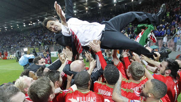 Wales manager Chris Coleman gets the bumps from his team