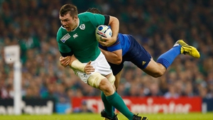 Ireland's Peter O'Mahony barges his way forward against France