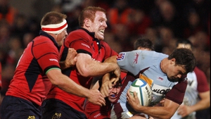 The forward makes a tackle during the 2006 Heineken Cup game against Bourgoin