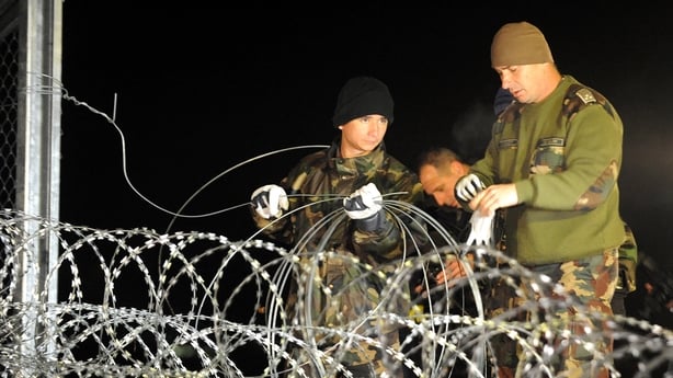 Hungarian police and soldiers close border between Hungary and Croatia with barbed wire and fence