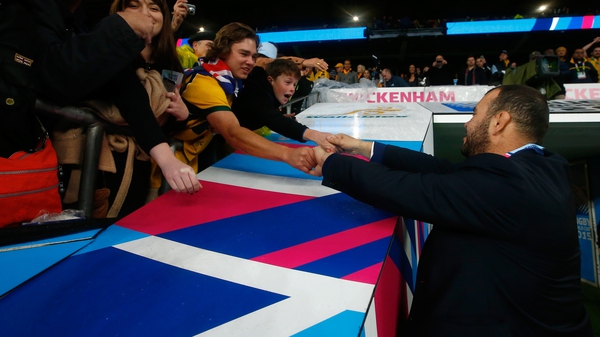 Michael Cheika celebrates with fans after Australia reached the Rugby World Cup semi-finals