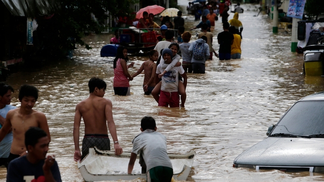 Typhoon downgraded to tropical storm