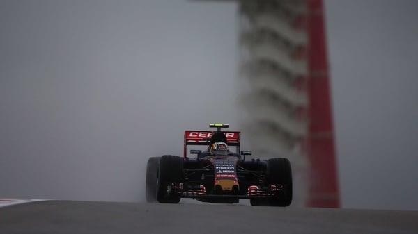Carlos Sainz of Spain and Scuderia Toro Rosso drives through difficult conditions in Austin