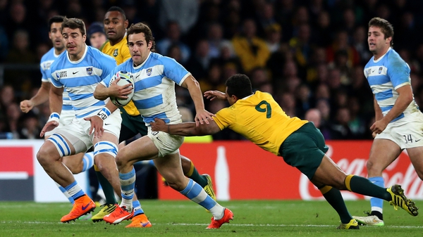 Nicolas Sanchez of Argentina is tackled by Will Genia of Australia