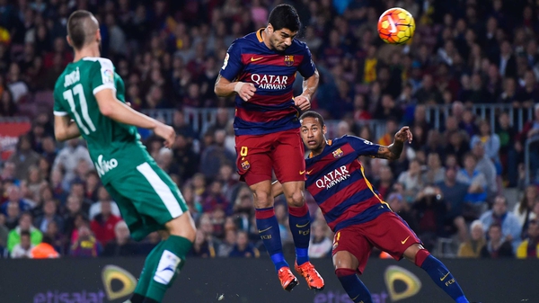 Luis Suarez heading home the first of his three goals against Eibar