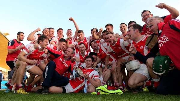 Cuala players celebrate a long overdue victory for the club