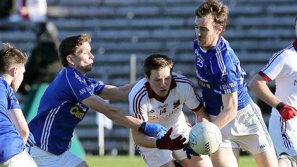 Scotstown's Fergal McPhilips and Damien Mc Ardle with Slaughtneil's Cormac Doherty