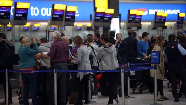 Passengers in Heathrow Airport as thick fog disrupts flights for a second day