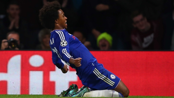 Willian celebrates his decisive free-kick at Stamford Bridge