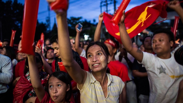 Supporters of Aung San Suu Kyi's National League for Democracy celebrate in the street