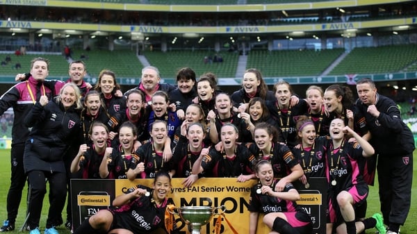 The players and staff of Wexford Youths Women celebrate their dramatic victory