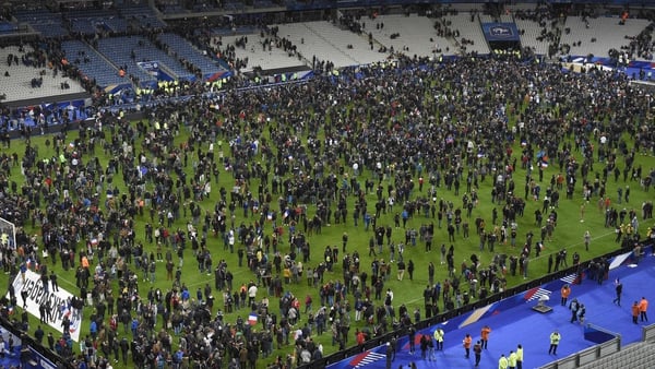 Spectators poured onto the pitch after explosions were heard near the Stade de France