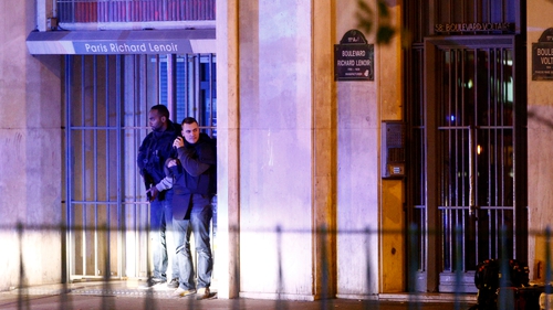 French police officers outside the scene of the hostage situation in Paris
