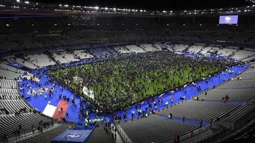 Fans poured on to the pitch at the Stade de France during the attacks in Paris last November