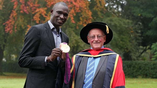 Brother Colm O'Connell with 800m world record holder David Rudisha in 2012 when he received an Honorary Doctorate from DCU