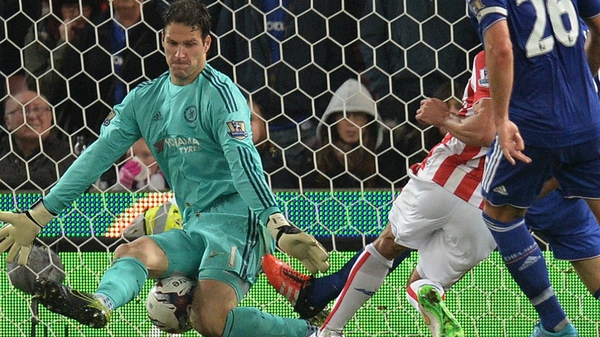 Jon Walters, playing for Stoke City, has his effort blocked by Chelsea's Asmir Begovic