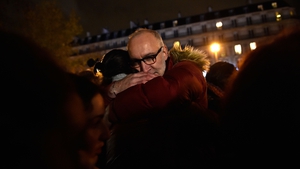 People hug on republic square in Paris