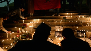 People gather for a candlelight vigil in Rabat, Morocco