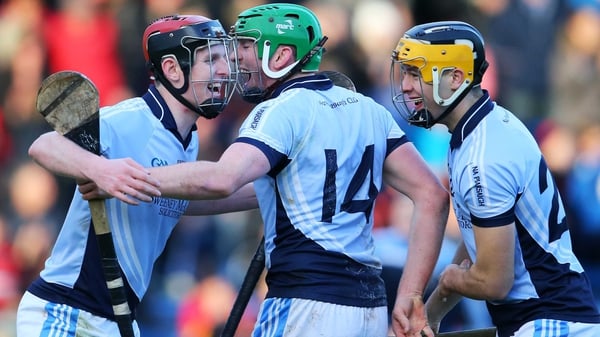 David Dempsey, Shane Dowling and Tommy Grimes of Na Piarsaigh celebrate after the final whistle