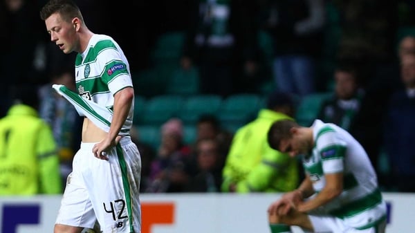Callum McGregor (L) reacts after Celtic's crushing defeat to Ajax