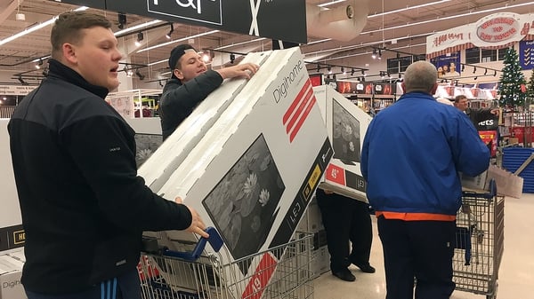 Early morning shoppers in the UK were seen loading up their trollies with high-value items including TVs