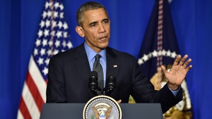 US President Barack Obama speaking at a climate change press conference in Paris