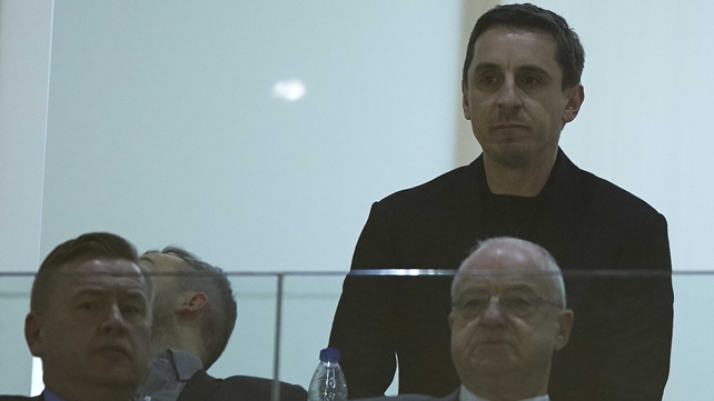 Gary Neville watches from the stands