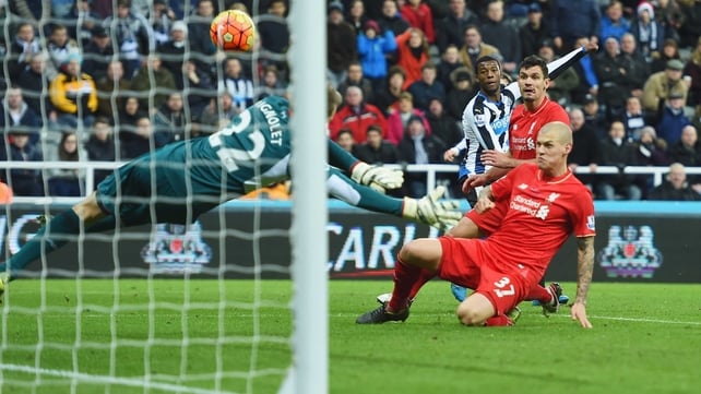 Martin Skrtel deflects Georginio Wijnaldum's effort past goalkeeper Simon Mignolet 