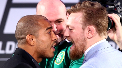 Jose Aldo (L) and Conor McGregor will face off in the octagon on Sunday