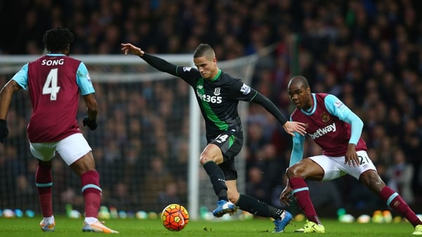 Ibrahim Afellay of Stoke competes for the ball against Alexandre Song and Angelo Ogbonna Obinz