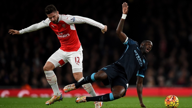 Yaya Toure is fouled by Olivier Giroud