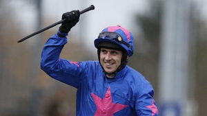 Paddy Brennan celebrates his King George VI Chase win on Cue Card