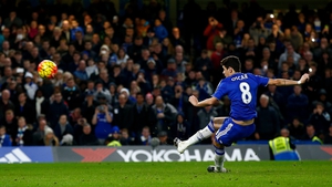 Oscar slips to send his late penalty high and over the crossbar