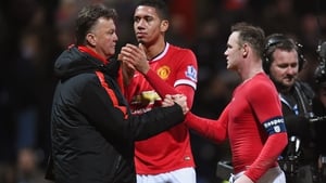 United manager Louis van Gaal congratulates his skipper Wayne Rooney