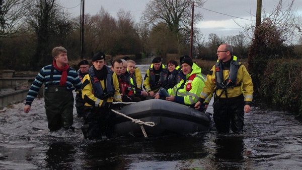 Minister Simon Coveney taking the boat in Clonlara as he visits flood-hit Clare